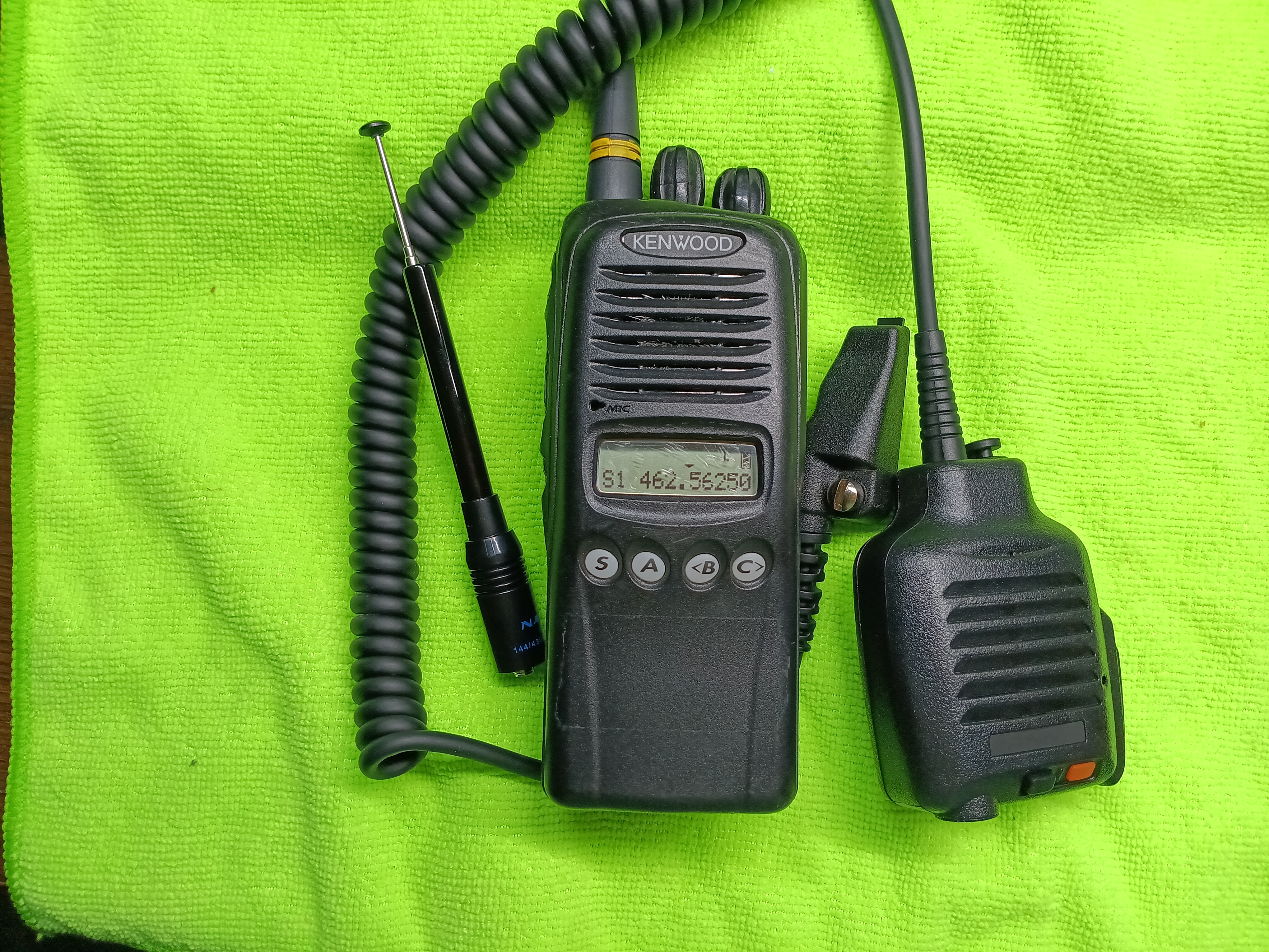 Front view of Kenwood TK-3180 radio showing screen, battery, & antenna's.