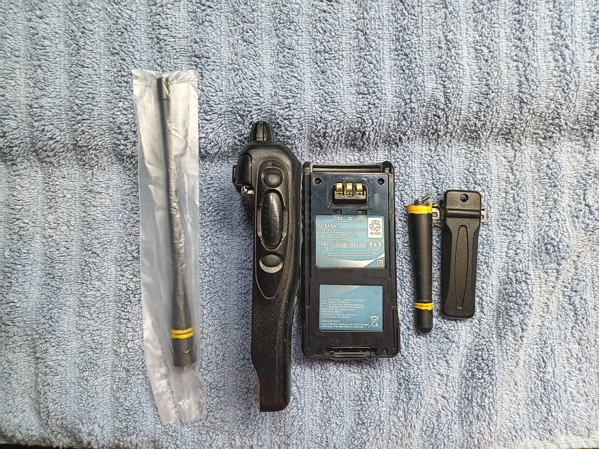 Side view of Kenwood TK-3180 radio showing screen, battery, antenna's & clip