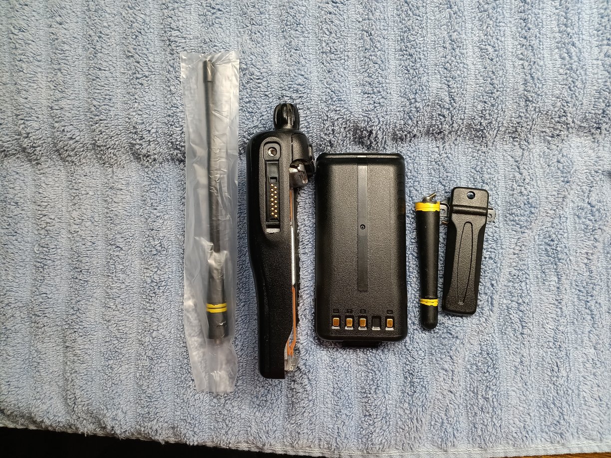 Right Side view of Kenwood TK-3180 radio showing screen, battery, antenna's & clip